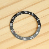 ロレックスGMTマスターIIブルースウェインギネスセラクロムウォッチのセラミックベゼルを見る